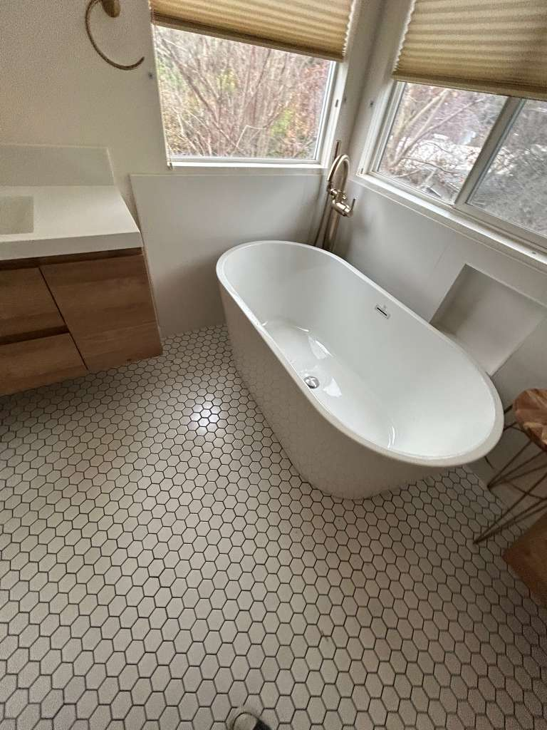 Hexagon tile floor with freestanding tub bathroom