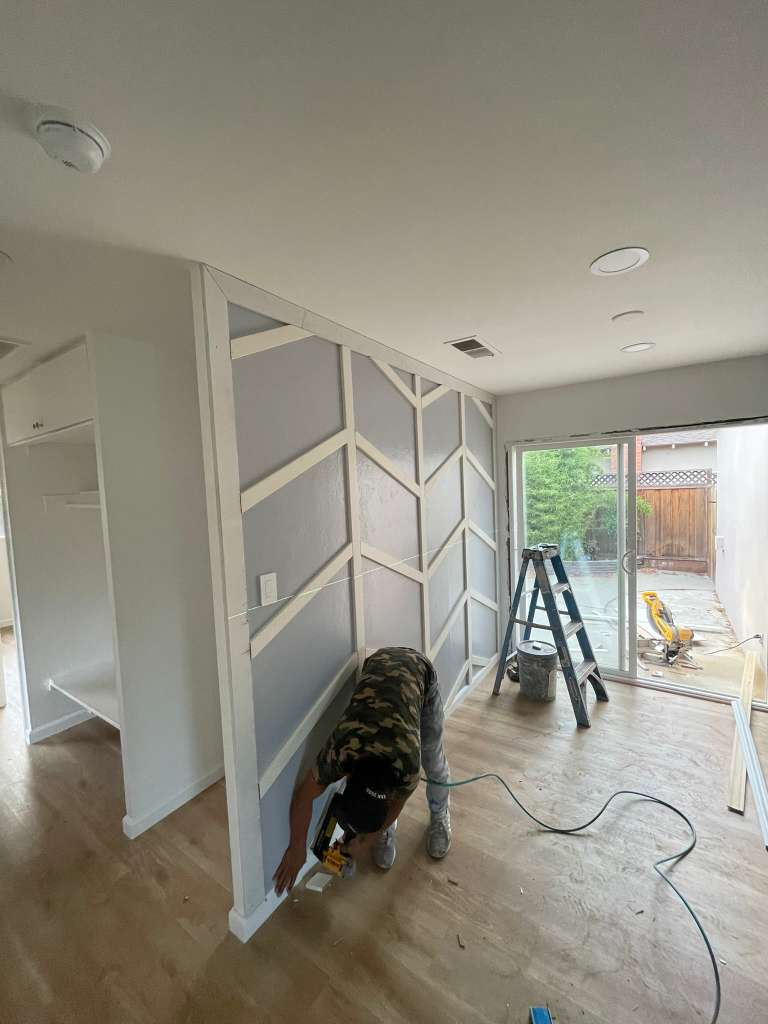 Interior accent wall renovation with custom trim work